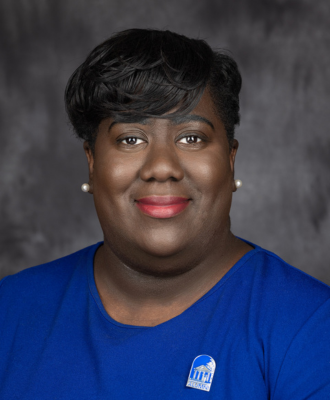 Monet Earle, Director of Alumni Relations & Engagement, smiling in headshot